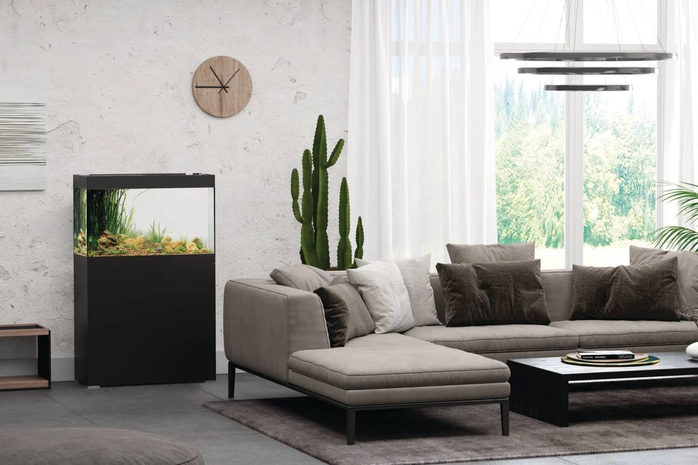 OASE StyleLine 175 sort i en lys stue med sofa, kaktus og store vinduer